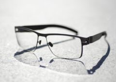 Closeup shot of a pair of glasses on a gray surface